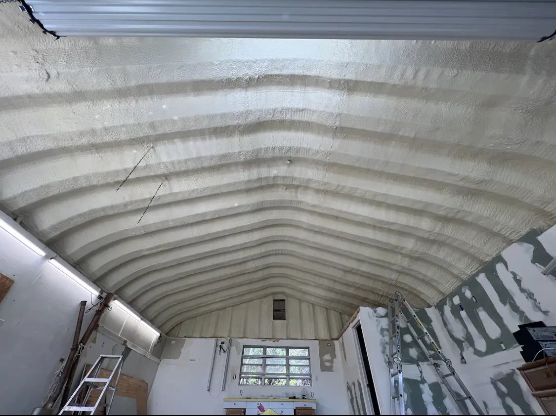 Spray polyurethane foam applied to the underside of a metal roof deck in Spring Hill